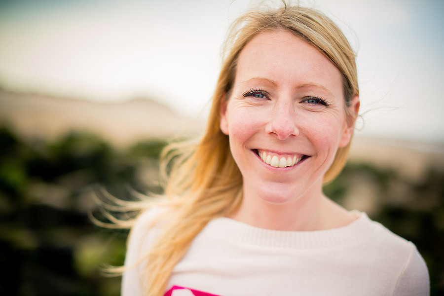 A happy engaged woman during her pre wedding photo shoot on Talacre Beach.