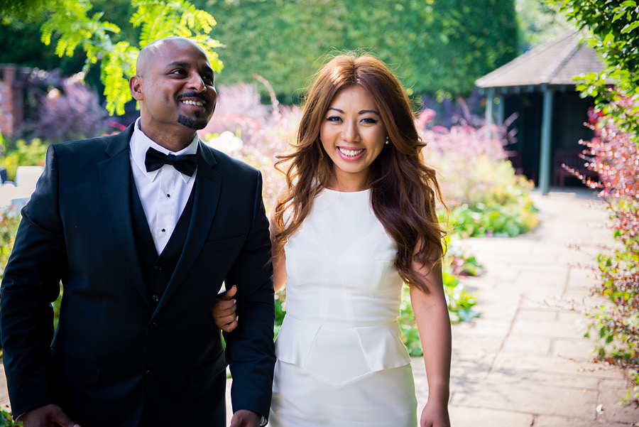 Bride and groom walking in the gardens of the lion quays, oswestry, shropshire