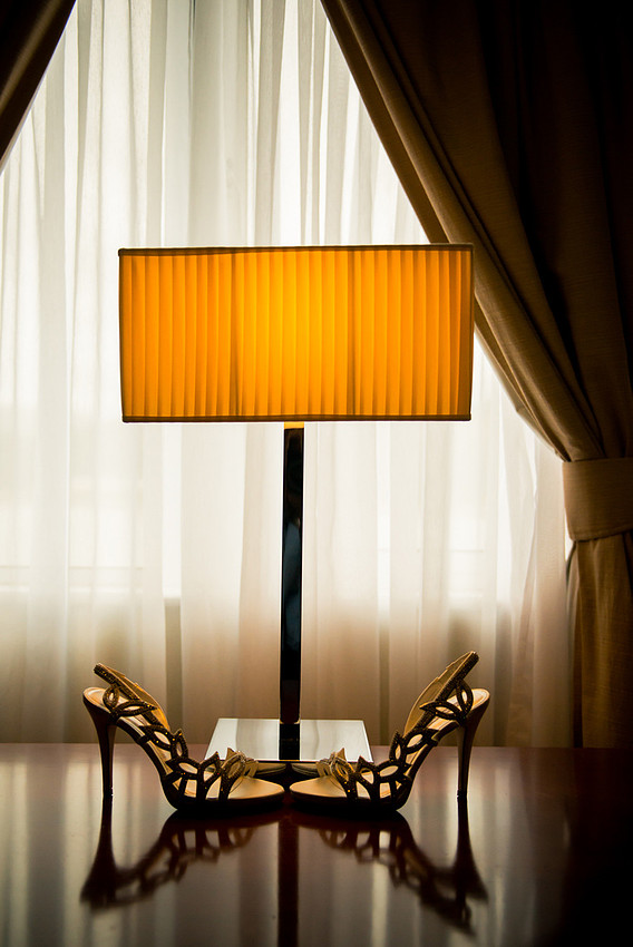 the brides Wedding shoes under a lamp at the Deganwy Quay: Wedding Photographer: Celynnen Photography