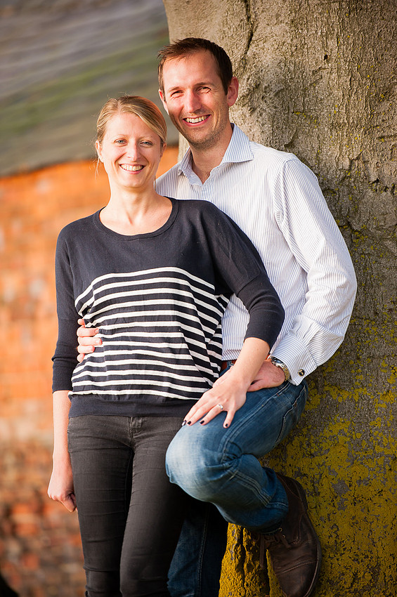 Portrait of couple leaning against a tree in Cheshire.