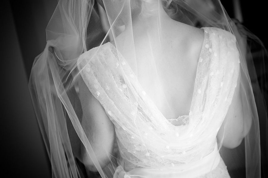 The bride putting her veil before her wedding at Nant-Gwythern by Celynnen Photography