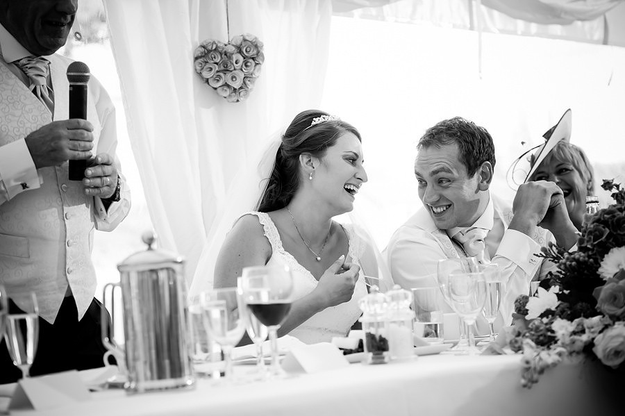 Wedding photographer Ruthin Celynnen Photography bride and groom laughing at the speeches