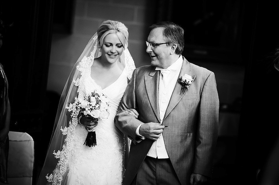 Father of the bride proudly walker her down the aisle at her wedding in Plas Newydd in Anglesey (Ioan Said / Celynnen Photography)