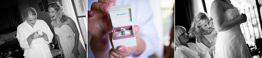 The bride showing her Pandora bracelet charm at Seiont Manor, Caernafon. Wedding photographer: Celynnen Photography