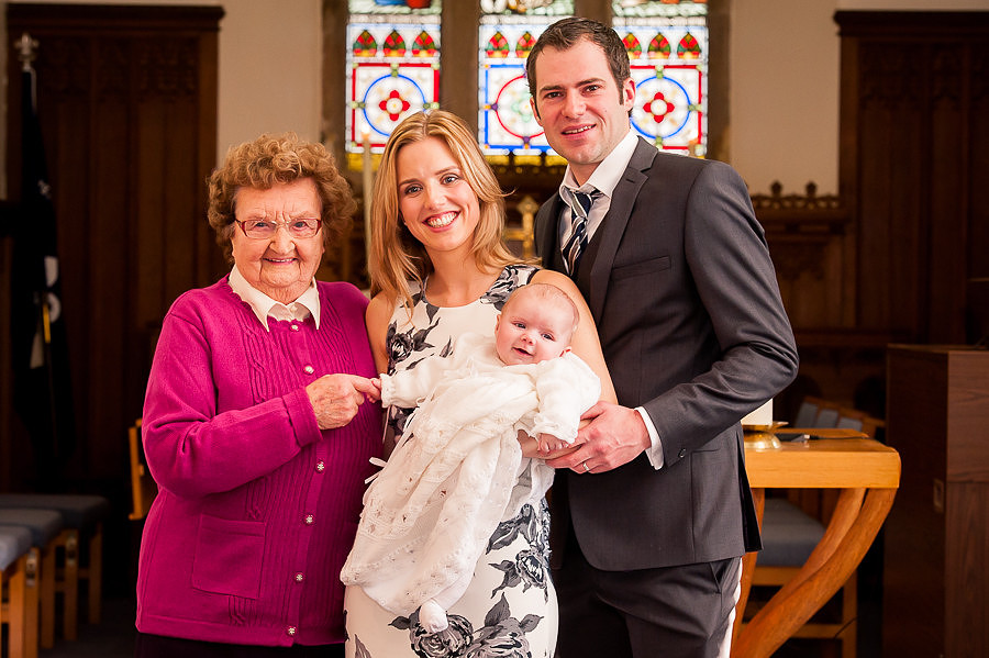 Amelia with her parents & friend after her Christening in St Maelog