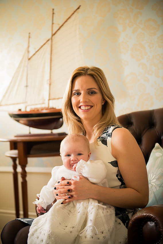 Amelia sitting with Mummy Rebecca after the Christening at Trearddur Bay Hotel.