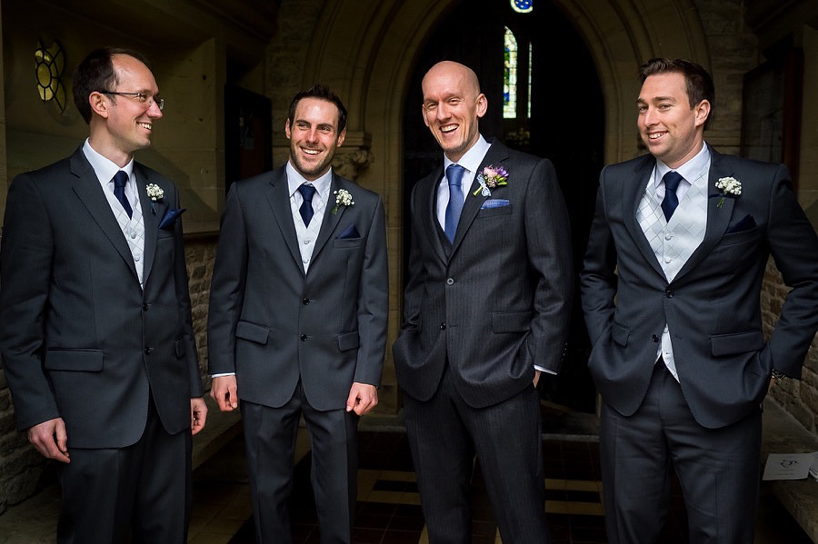 A photograph of Ross, his Best Man & Ushers waiting at the door of St John the Evangelist Church in Rhydymwyn .