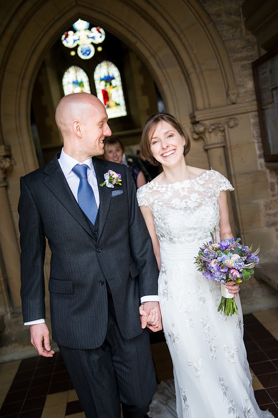 A photograph of Ross & Mair as they left church after the wedding service.