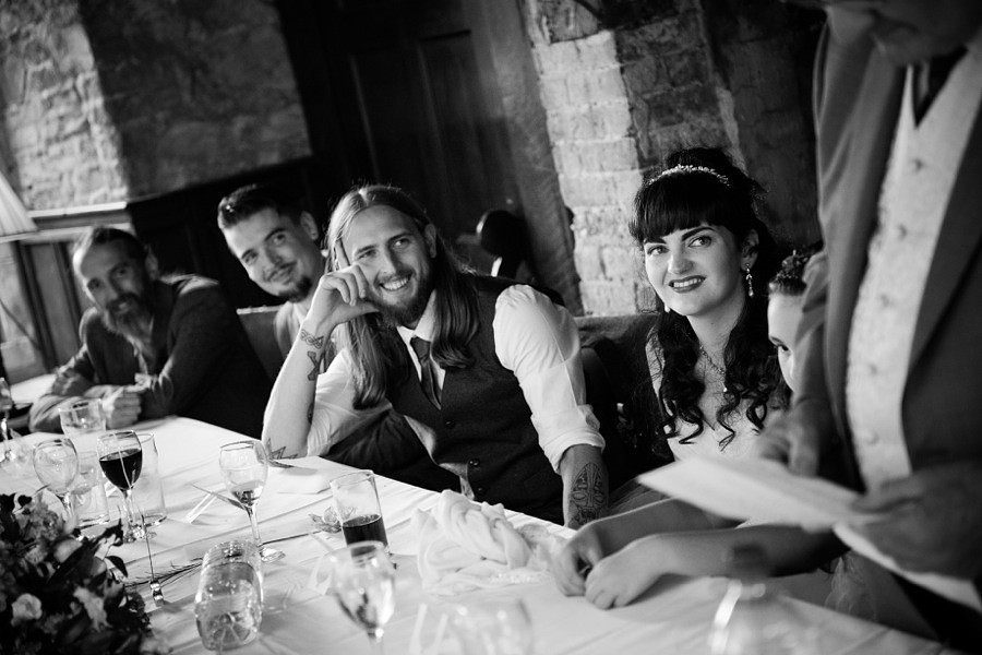 Groom enjoying the speeches at his wedding  at Gwydir Castle, by Celynnen Photography, North Wales wedding photographer of the year