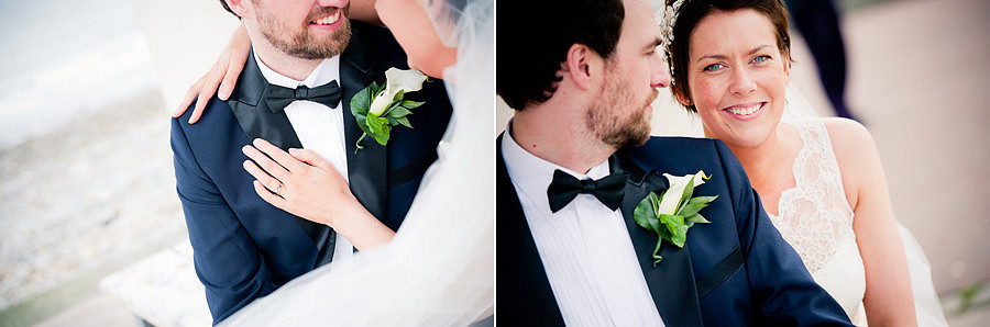 the bride and groom on the llandudno promenade at the St-Georges Hotel, Llandudno by Celynnen Photography