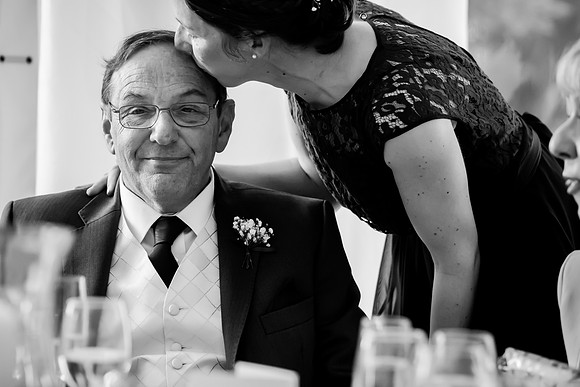 Father of the bride, being kissed on the head after his speech at Soughton Hall near Mold, Flintshire