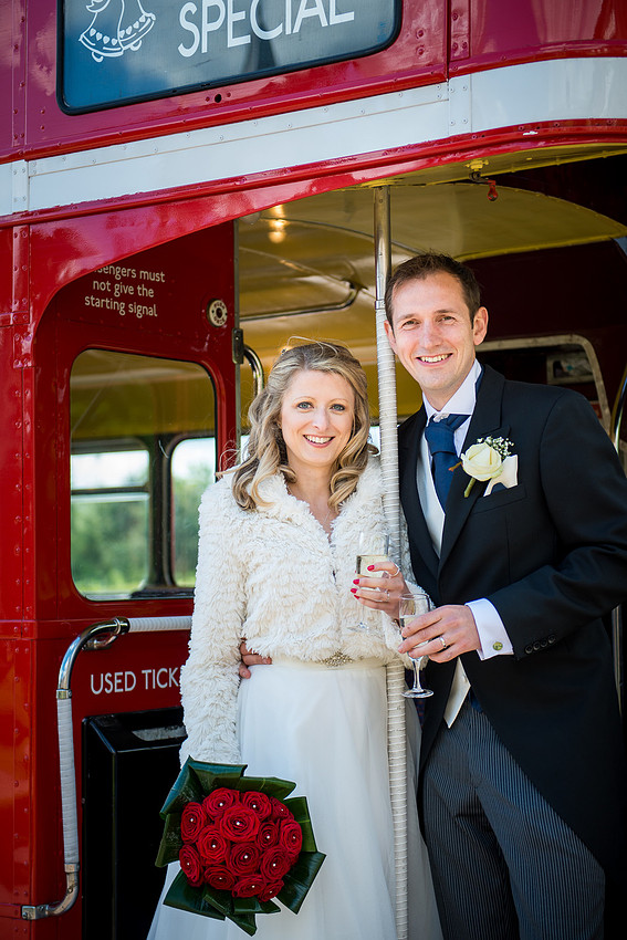 Portrait of the bride and groom on a bus at their wedding in Davenham, Cheshire.