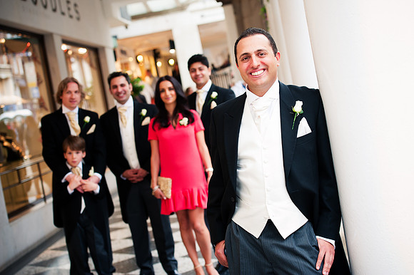 Groom and his family pose for a portrait outside of Chester Grosvenor Hotel, captured by Celynnen Photography