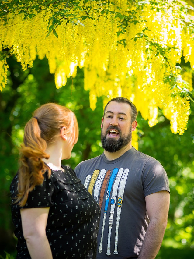 Photograph of Paul & Claire chatting on their Pre Wedding shoot in Sefton Park, Liverpool.