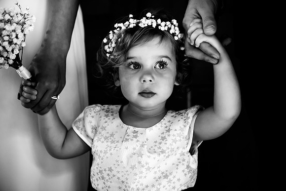 A Picture From the Adorable Baby Girl Holding her Dad and Mom's Hands