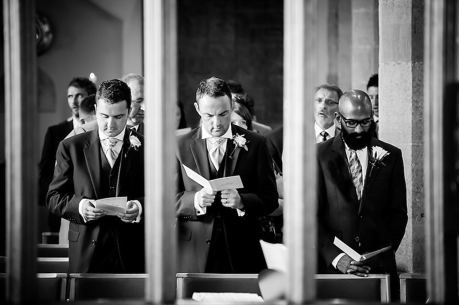 Black and white image of the ushers during the wedding ceremony in Chester