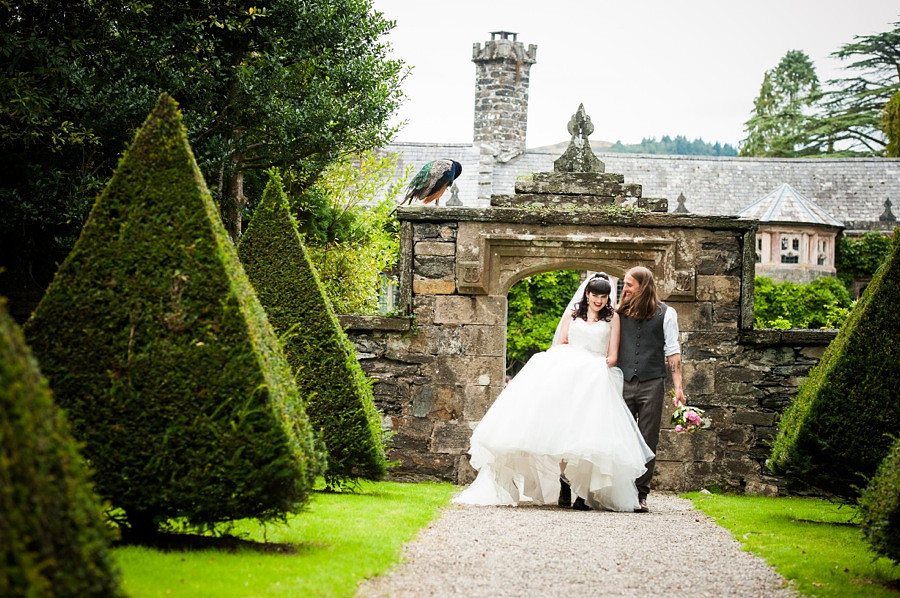 Bride and groom walking around the grounds at Gwydir Castle, by Celynnen Photography, North Wales wedding photographer of the year
