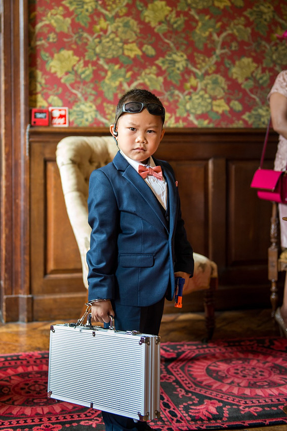 Funny portrait of a child from a wedding at Soughton Hall.