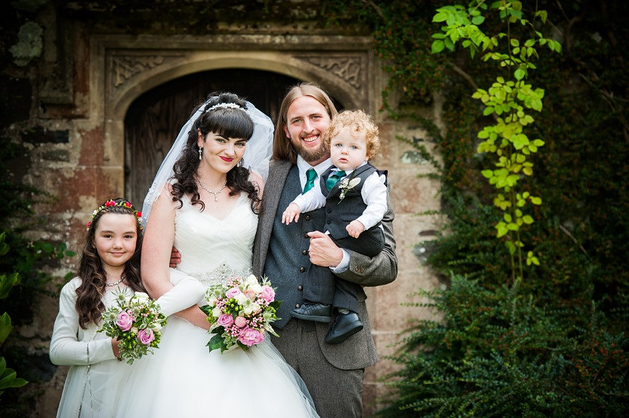 Bride, groom and their two children on their wedding day at Gwydir Castle, by Celynnen Photography, North Wales wedding photographer of the year