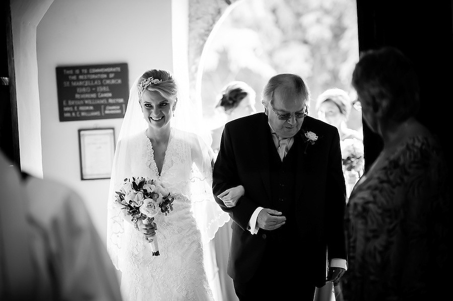 Black and white image of the bride and groom arriving for a wedding in Chester.