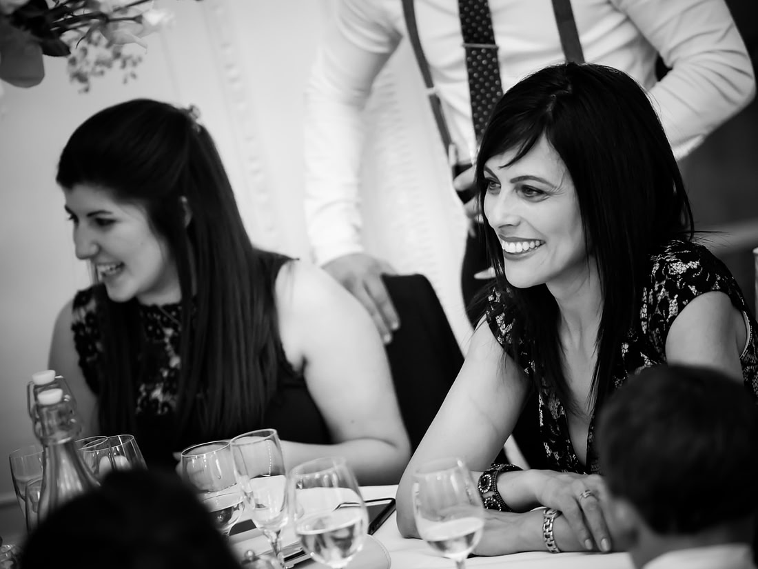 Black and white image of some guests at a wedding in Buckinghamshire.
