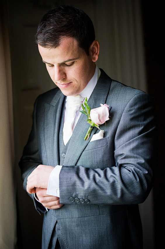 Groom getting dressed for his wedding at Chateaux Rhianfa, Anglesey. Wedding Photographer, Celynnen Photography