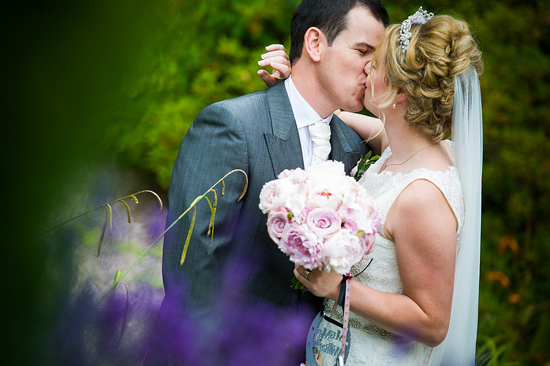 Bride and groom kissing. Wedding at Chateaux Rhianfa, Anglesey. Wedding Photographer, Celynnen Photography