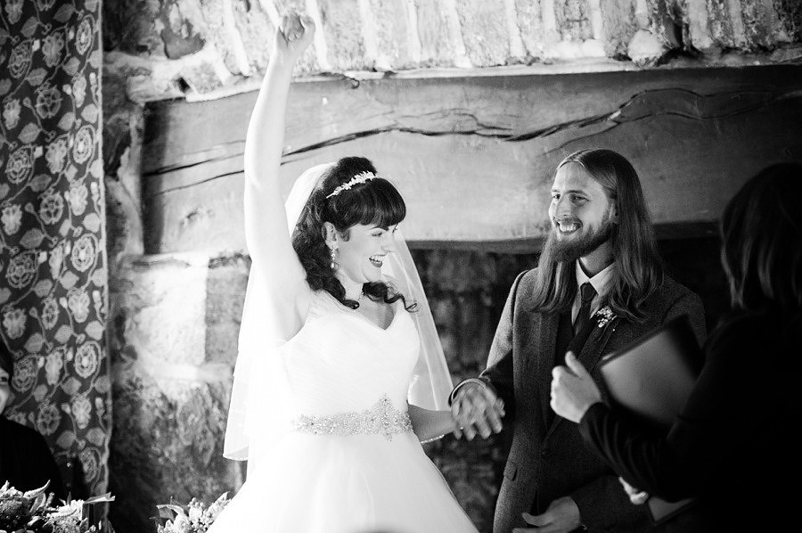 bride cheering during her wedding at Gwydir Castle. North Wales Wedding photographer, Celynnen Photography