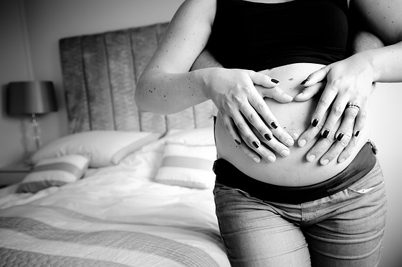 Portrait of pregnant woman during a bump to baby photoshoot with Celynnen Photography