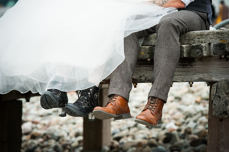Bride and groom show off their shoes on their wedding day in llandudno by North Wales wedding photographer, Celynnen Photography