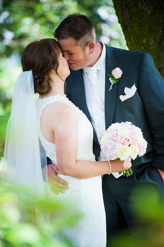 bride and groom kissing. Wedding in Chateaux Rhianfa, Anglesey. Wedding Photographer, Celynnen Photography