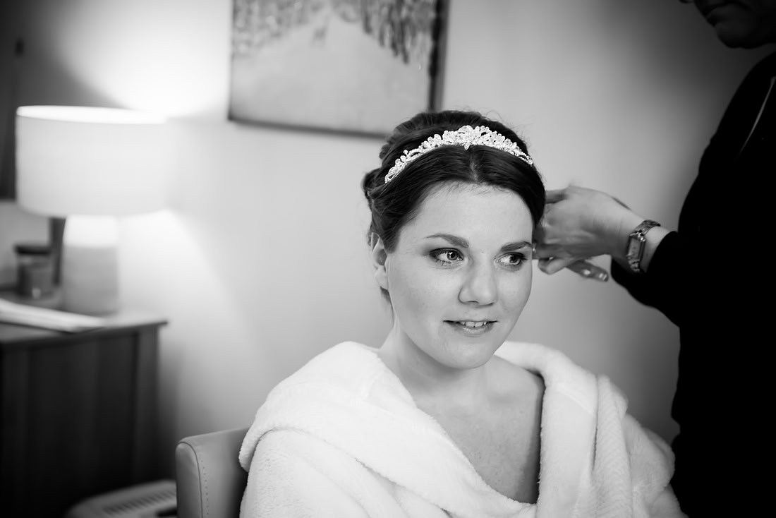 Black and white image of the bride during bridal preparations for her wedding at Mere Brook House.