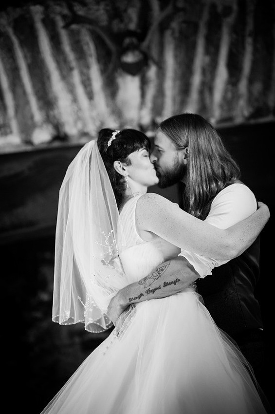 Bride and groom kissing at their wedding in gwydir Castle, conwy. North Wales Wedding photographer, Celynnen Photography