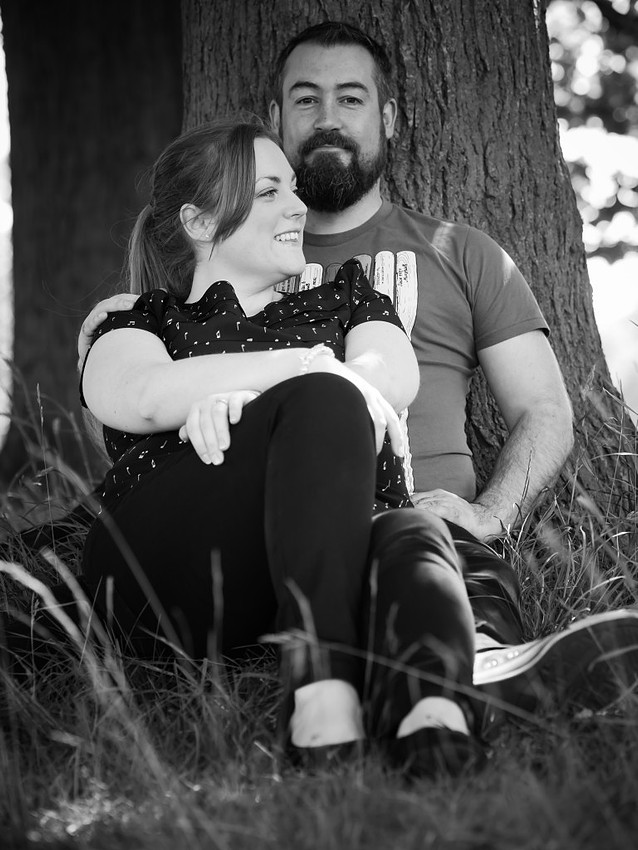 Photograph of Claire & Paul sitting against a tree in Sefton Pak, Liverpool. Taken in black & white.
