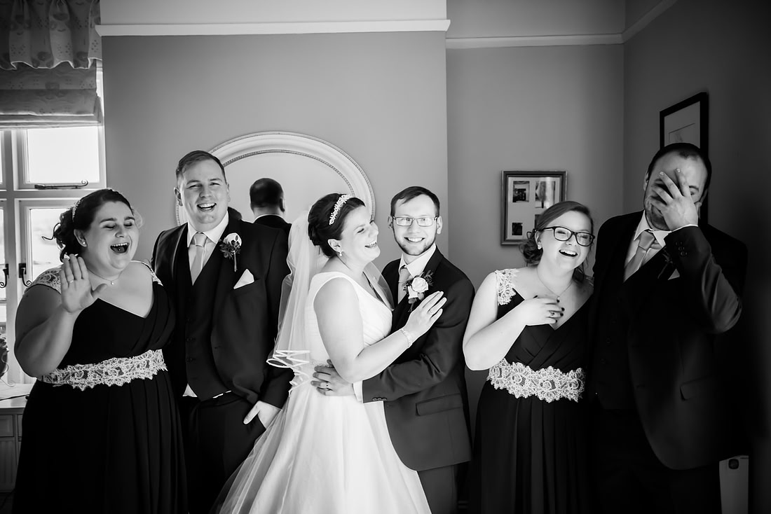 Black and white portrait of all the bridal party at Mere Brook House.