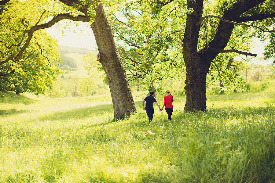 A couple taking a stroll around Crogen Estate for their pre-Wedding portrait session by North Wales portrait and wedding photographer Celynnen Photography