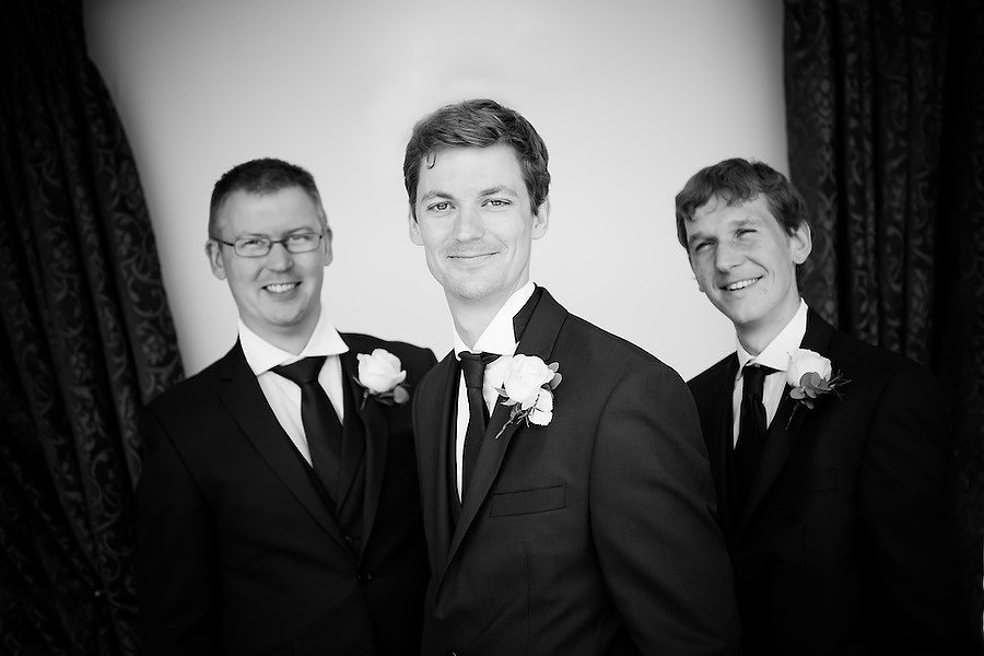 Black and white image of the groom and his ushers at his wedding at Plas Hafod.