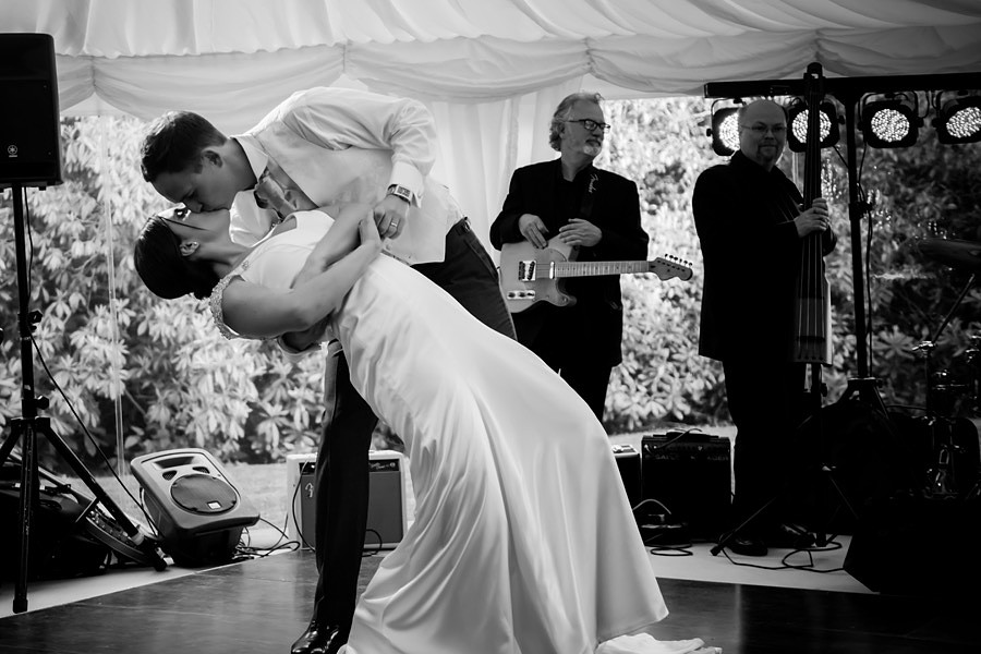 Black and white image of the bride and groom during their first dance at their wedding reception at Tros-yr-Afon, Anglesey. Wedding Photographer, Celynnen Photography