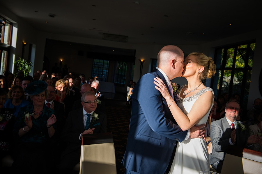 Bride and Groom kissing at the end of the ceremony by North Wales Wedding Photographer Celynnen Photography