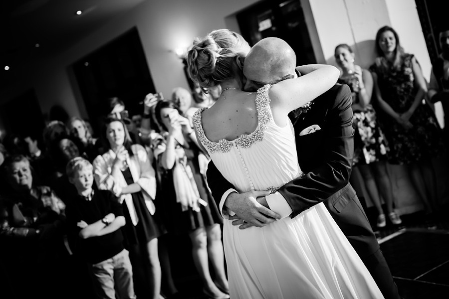 Bride and Groom hugging during first dance by North Wales Wedding Photographer Celynnen Photography