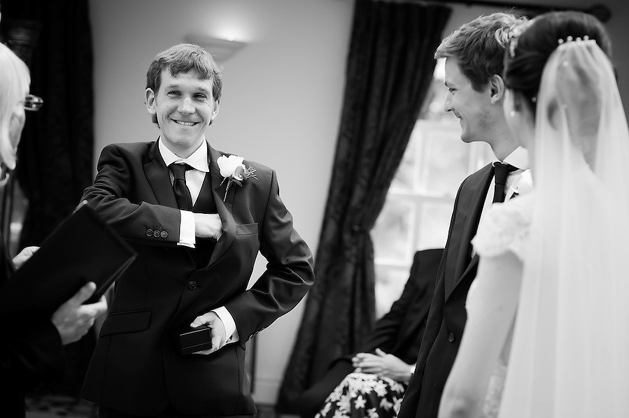 Black and white image of the best man getting the wedding rings for a wedding at Plas Hafod.