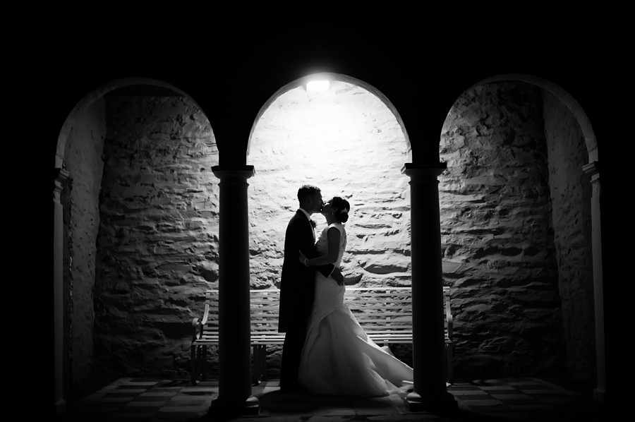 Bride and Groom Kiss on Wedding Day by Photographer Celynnen Photography