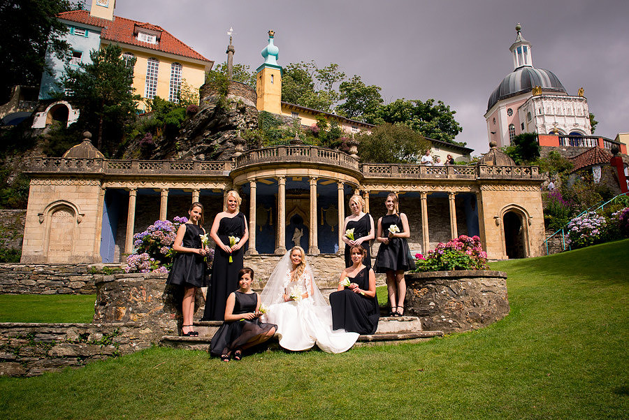Bride and bridesmaids during a wedding in Portmeirion, in the plaza. Wedding Photographer: Celynnen Photography