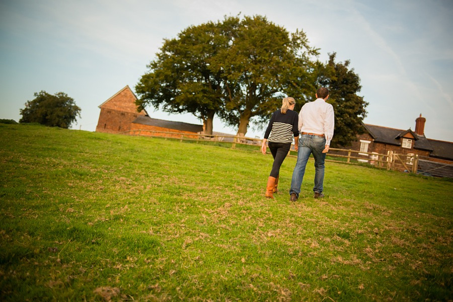 Photo of couple walking away from the camera in their pre wedding photoshoot.
