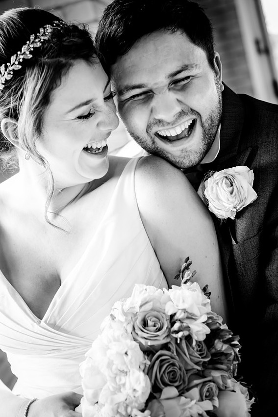 Couple laughing at their wedding  at Seiont Manor