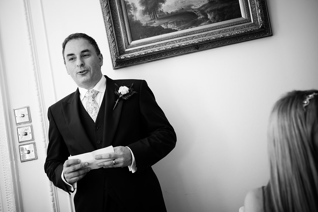 Black and white image of the groom during his speech at a wedding in Buckinghamshire.