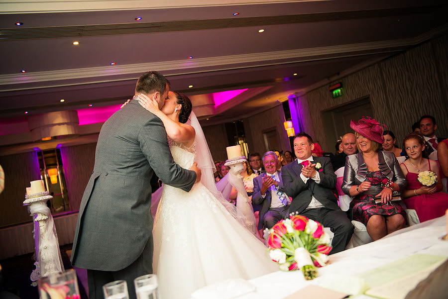 Photo of the bride and groom's first kiss as a married couple at their wedding at Grosvenor Pulford