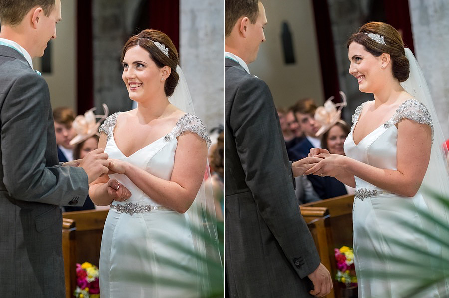 Bride and groom exchanging the rings at a wedding in Anglesey.