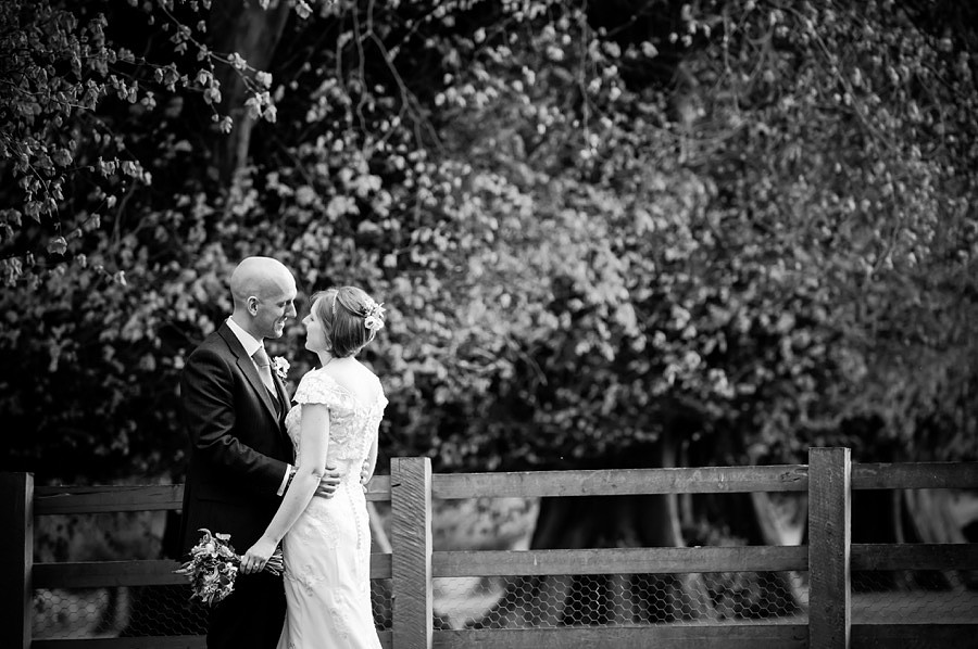 Black & White shot of Ross & Mair, photographed in the grounds of Soughton Hall on their wedding day by Celynnen Photography.