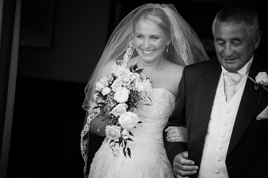 The bride during the wedding ceremony at Seiont Manor, Caernarfon. Wedding photographer: Celynnen Photography